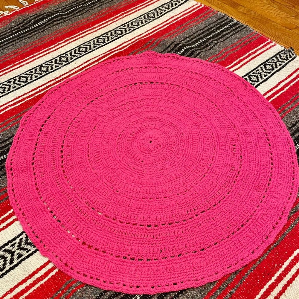 Hand knitted rug made of acrylic yarn